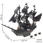 Navire pirate en bois noir avec voiles et détails décoratifs, parfait pour la décoration ou comme objet de collection.