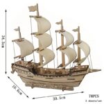 Navire en bois avec voiles en tissu, modèle de bateau pirate ou ancien, décoration de collection, parfait pour un intérieur maritime ou nautique.