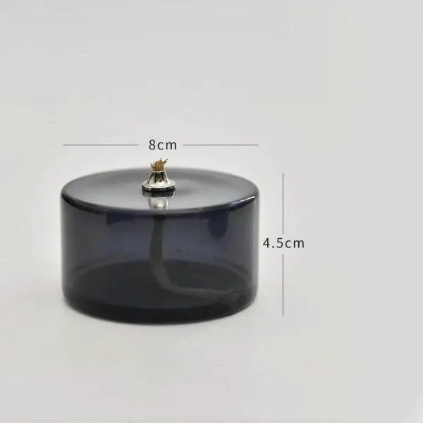Porte-encens en verre fumé noir avec figurine de chat en or, idéal pour la décoration de votre espace. Dimensions : 8 cm de diamètre et 4,5 cm de hauteur.
