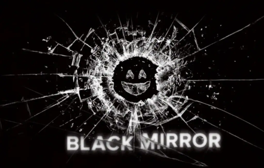A black mirror with a cracked surface featuring a smiling face, resembling a broken reflective surface, with the text "BLACK MIRROR" below.