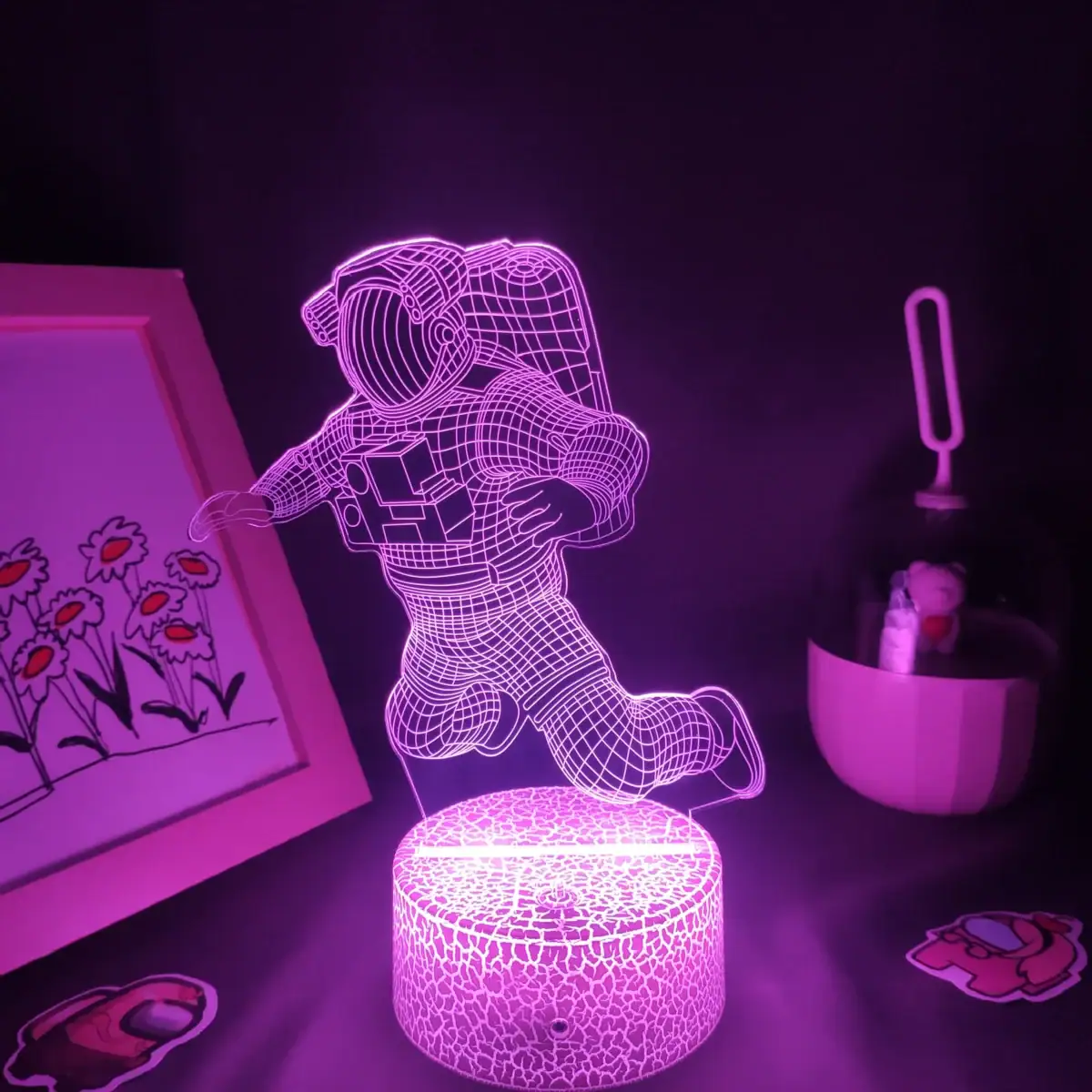 Lampe LED 3D en forme d'astronaute flottant.
