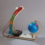 Modèle éducatif avec globe terrestre et expérience scientifique illustrant la rotation de la Terre, idéal pour l'apprentissage en classe ou à la maison.